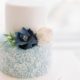 Simple and elegant two-tier midcentury-Inspired wedding cake. Perfect for a beach wedding. Photography: festtagsfotog