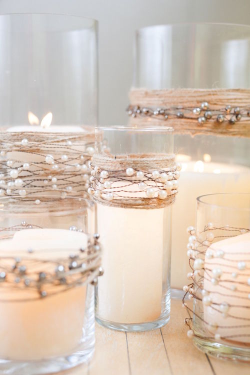 Candle wedding centerpieces decorated with pearl beads on wire garland with natural jute twine.