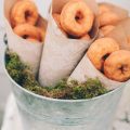 We can even give out doughnuts as wedding favors. Is there anything more delicious and inexpensive than that? Photographers: The Carrs Photography and Jenny Haas Photography.