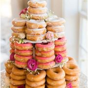 Scrumptious vintage doughnut wedding cake. Add frosting, roses, baby's breath and some greenery. Photo by Emily Sacra Photography.