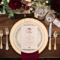 Burgundy, white, and gold fall place setting. Read more about how to set a wedding table on this article. Ashley Cook Photography.