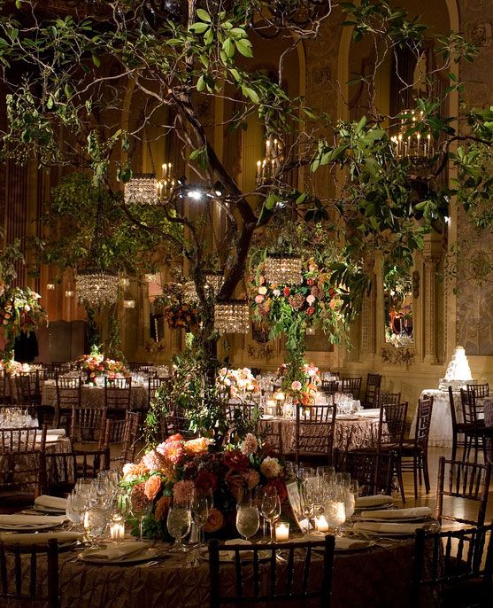 Incorporate a decorated tree to the indoor venue to create a magical forest wedding. Gorgeous!