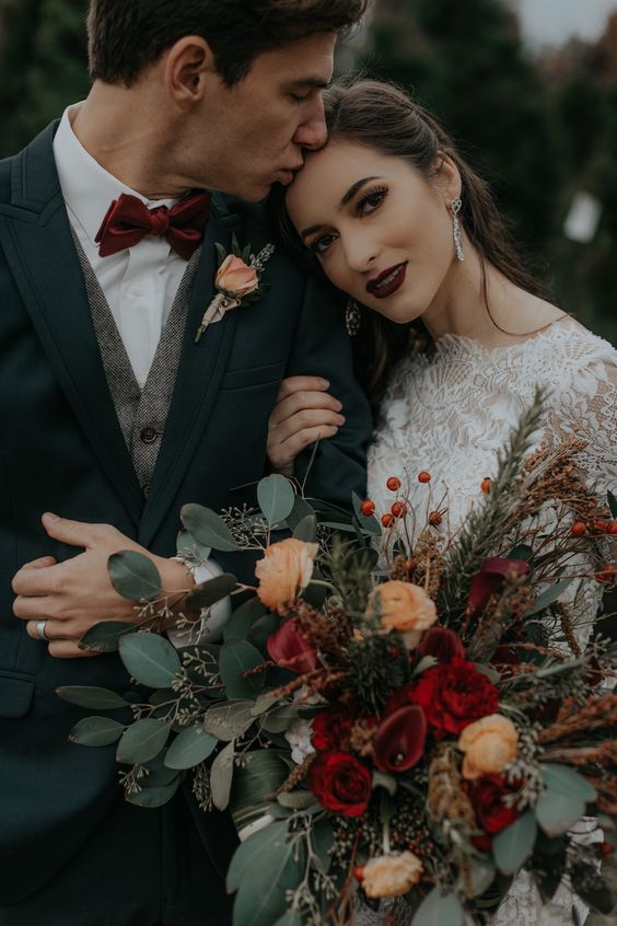 You can have a vintage enchanted forest wedding. This couple picked burgundy and copper hues gor their woodland wedding.