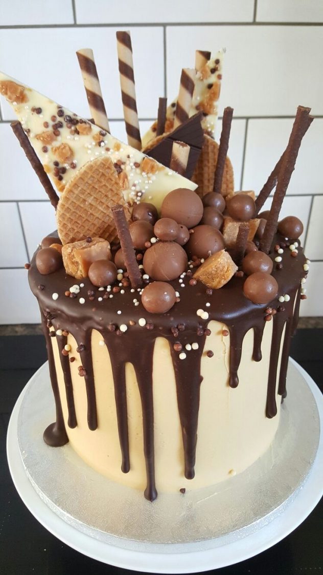 Full-on candy explosion over this waffle drip cake for unconventional couples. Would you cut this cake or pull the candy one by one?