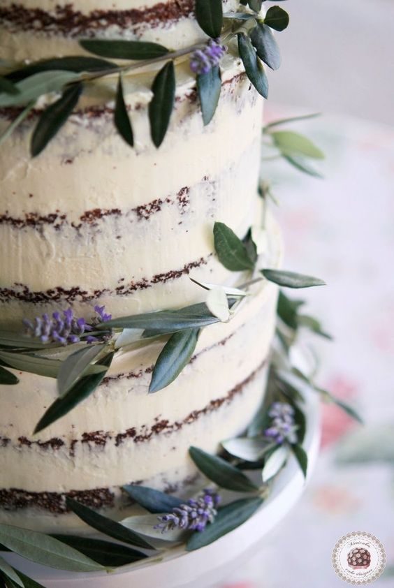 Semi naked winery-inspired wedding cake with olive branches and lavender.