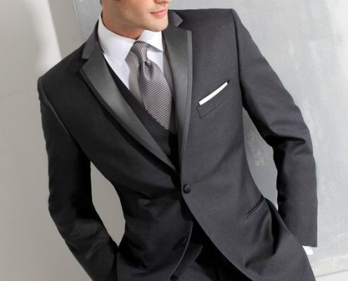 Slender grooms can wear a higher button stance, like on this three piece tuxedo.