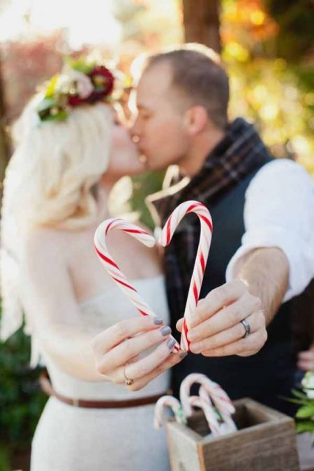 You know it's a Christmas wedding when there's candy canes on the wedding photos. Kim J. Martin Photography.