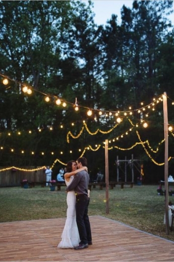 How much space will you spare for the dance floor? Find out how to plan a backyard wedding. Floral decor by Flowers by Frankie and photographed by Clay Austin Photography.