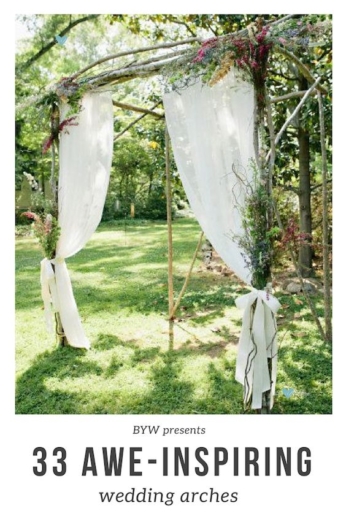 A simple arch made with white birch branches, fabric and dried flowers.