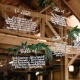 Amazing and original hanging acrylic seating charts with greenery.