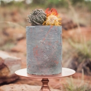 If you are anything like us, this tall one tier concrete cake will steal your heart. It boasts an industrial vibe merged with bohemian rusticity. Photo: Because Life Photography.