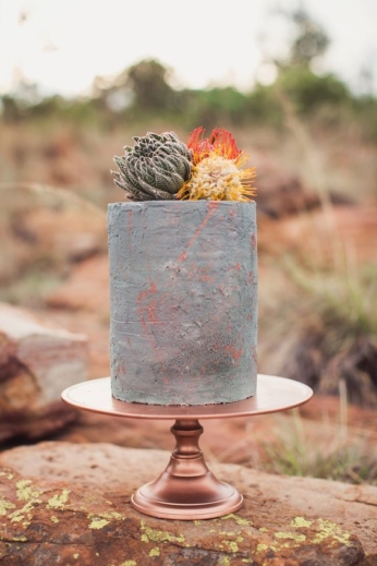 If you are anything like us, this tall one tier concrete cake will steal your heart. It boasts an industrial vibe merged with bohemian rusticity. Photo: Because Life Photography.